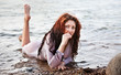 Photo: woman in a bathing suit lying in the water woman in a bathing suit lying in the water