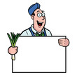 Greengrocer holding a fresh leek and a sign