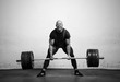 Powerlifter with strong arms lifting weights