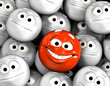Happy laughing emoticon face among others