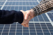 Hadshake in front of Photovoltaic panels Hadshake in front of Photovoltaic panels