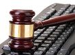 wooden gavel on keyboard isolated on white wooden gavel on keyboard isolated on white