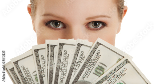 Photo: face of beautiful young woman and the money- dollars face of beautiful young woman and the money- dollars