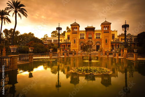Photo: Mudejar Pavilion and pond at sunset. Sevilla, Spain Mudejar Pavilion and pond at sunset. Sevilla, Spain