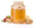 glass jar full of honey and fruit glass jar full of honey and fruit