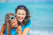 Mother and her daughter having fun on beach Mother and her daughter having fun on beach