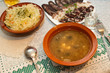 Russian cuisine: mushroom soup,  sauerkraut, meat and vodka.