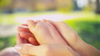 Hands Tenderly Cradling Baby Foot in Close up