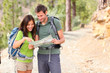 Hiking - hikers looking at map