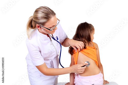 Foto: Doctor doing medical examination to a child Doctor doing medical examination to a child