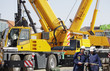 giant mobile cranes and site workers giant mobile cranes and site workers