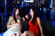 Attractive woman in night club with a drink
