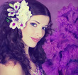 Photo: Portrait of the young, beautiful brunette in a lilac dress and w Portrait of the young, beautiful brunette in a lilac dress and w