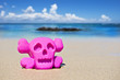 Photo: Pink toy on the beach showing danger Pink toy on the beach showing danger