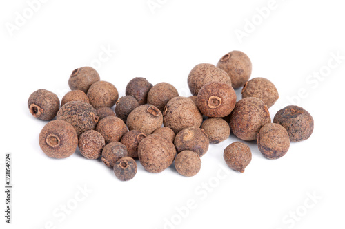 Photo: Pile Allspice (jamaica pepper) isolated on white background. Pile Allspice (jamaica pepper) isolated on white background.