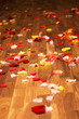 Petals of roses on the wooden floor