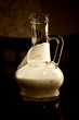 The pitcher with sauce on the dark