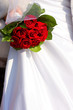 the bouquet of roses and the white dress