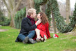 Romantic couple in love sitting on the grass