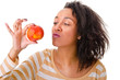 Portrait of an attractive girl with a ripe apple