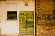 Photo: textured old door and holy picture on italian wall textured old door and holy picture on italian wall