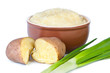 Photo: Mashed potatoes with green onions on white background. Mashed potatoes with green onions on white background.