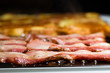 Thick cut bacon and French Toast on the grill for breakfast