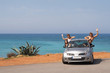 The company of young people traveling by car