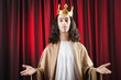 Funny king against red curtain Funny king against red curtain