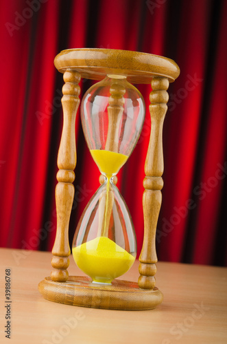 Photo: Hour glass in time concept Hour glass in time concept