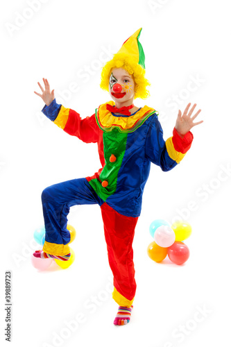 Photo: child dressed as colorful funny clown with balloons child dressed as colorful funny clown with balloons