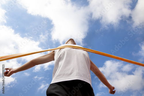 Photo: Winning runner with cloud background Winning runner with cloud background