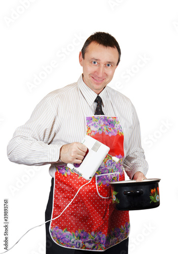Photo: Positive man with a pan and a mixer Positive man with a pan and a mixer