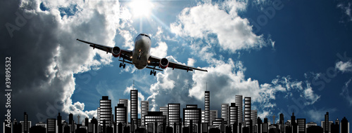 Photo: Passenger jet set against cityscape illustration Passenger jet set against cityscape illustration