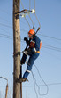 Photo: Electrician working at height with wires Electrician working at height with wires