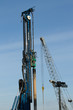 Pile driver and crane.