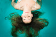 Photo: Wellness - junge Frau beim Floaten oder Schweben im Wasser Wellness - junge Frau beim Floaten oder Schweben im Wasser