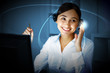Young woman in business wear and headset