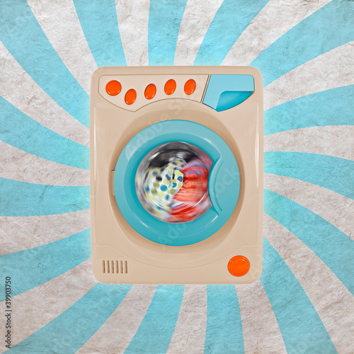 Photo: Concept of a colorful washing machine with a retro background Concept of a colorful washing machine with a retro background