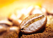 Arabic coffee beans on the golden light beam