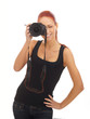 A young and attractive redhead female photographer