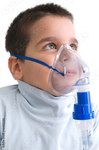 Photo: Cute little boy using nebuliser for asthma. Cute little boy using nebuliser for asthma.