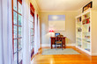 Home office interior with large windows.