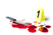 evidence marker with blood and knife isolated on white