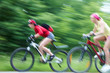 two  young girls on bicycle