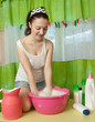 girl washes clothes