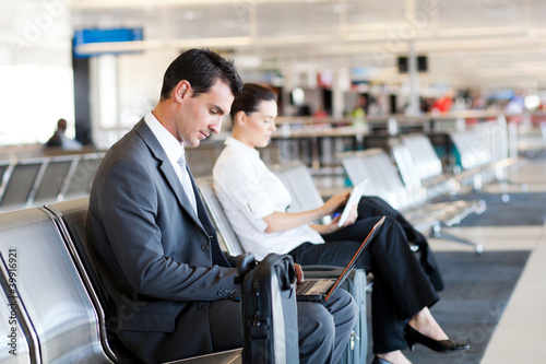 Photo: businessman and businesswoman at airport businessman and businesswoman at airport