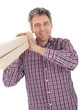 Builder carrying timber