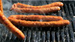 Man Grilling Sausages