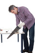 Worker cutting piece of laminate